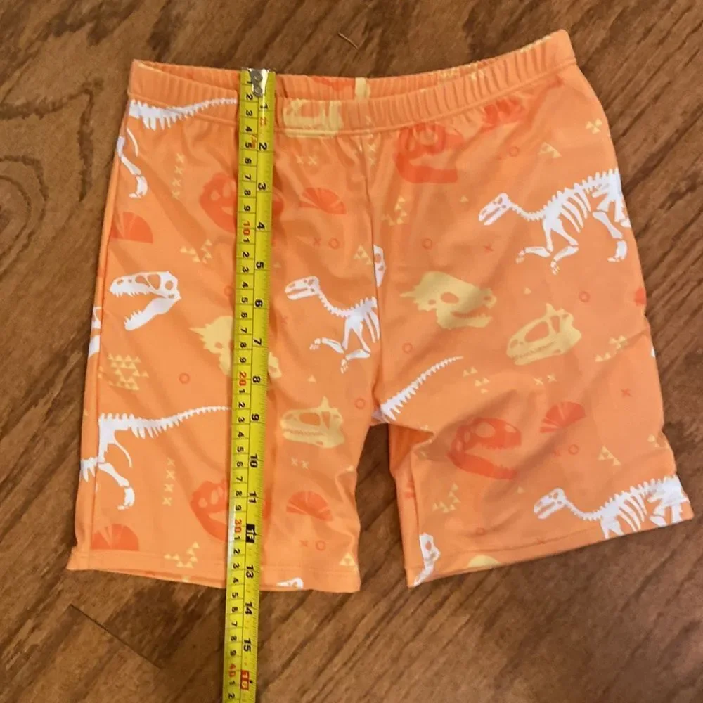 NWOT boys or girls swim shorts size 152 which is an 11/12 - dinosaurs, orange